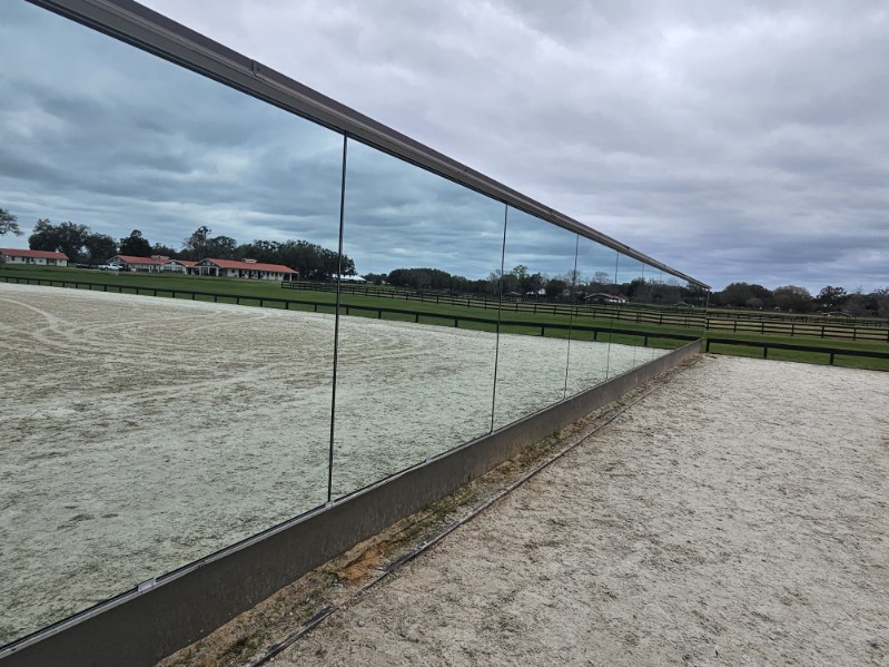 ClearStride outdoor dressage arena mirror wall reflecting the arena — installed by Robinson Glazing Solutions